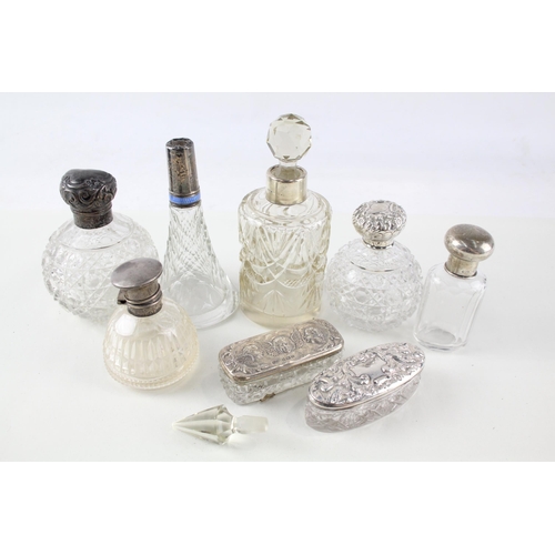 2332 - Eight .925 sterling silver topped and cut glass dressing table jars/bottles