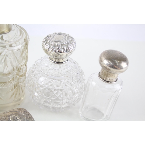 2332 - Eight .925 sterling silver topped and cut glass dressing table jars/bottles