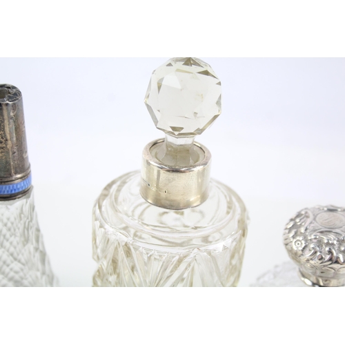 2332 - Eight .925 sterling silver topped and cut glass dressing table jars/bottles