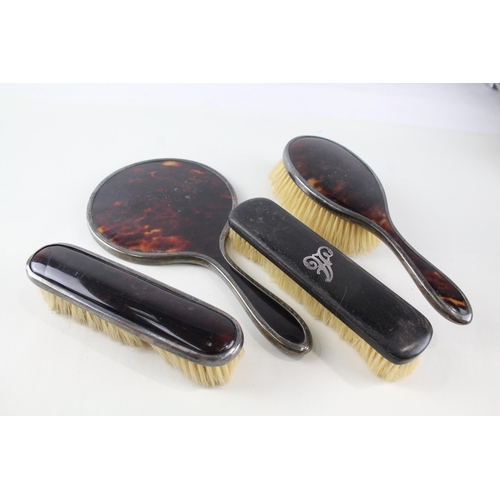 2334 - Four .925 sterling silver and faux tortoiseshell vanity accessories, three brushes and one mirror