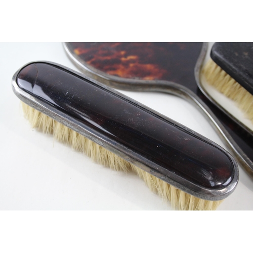 2334 - Four .925 sterling silver and faux tortoiseshell vanity accessories, three brushes and one mirror