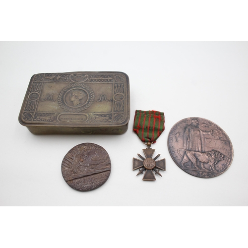 2358 - Four pieces of militaria, one WWI Princess Mary Christmas tin, one French Croix De Guerre medal, one... 