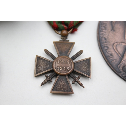 2358 - Four pieces of militaria, one WWI Princess Mary Christmas tin, one French Croix De Guerre medal, one... 