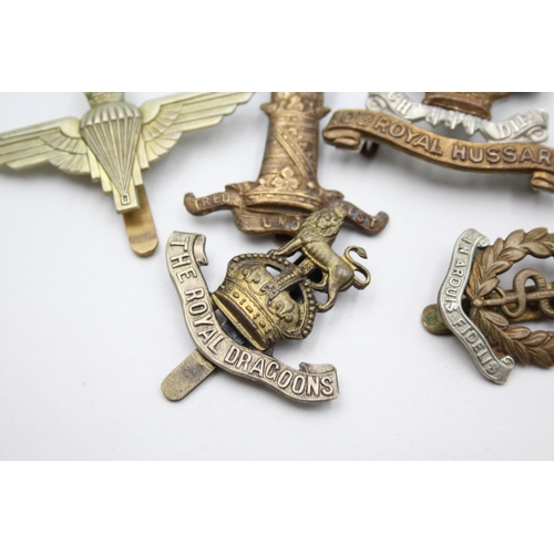 2359 - Ten military cap badges