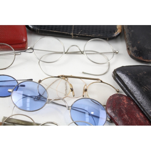 485D - A collection of antique and vintage spectacles to include pince-nez etc.