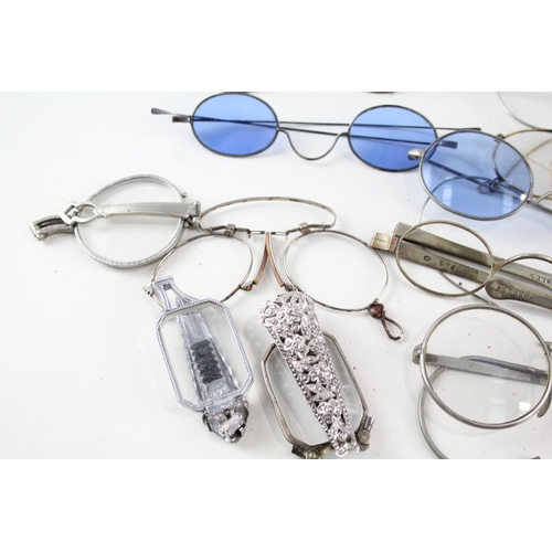 485D - A collection of antique and vintage spectacles to include pince-nez etc.