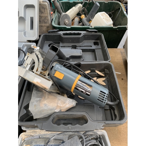 Four cased power tools, one Ryobi sander, one Rotozip Rebel spiral saw