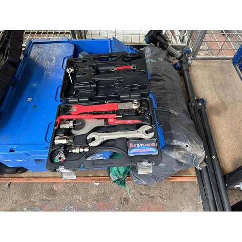 A collection of items to include Einhell percussion drill, Bike Hand