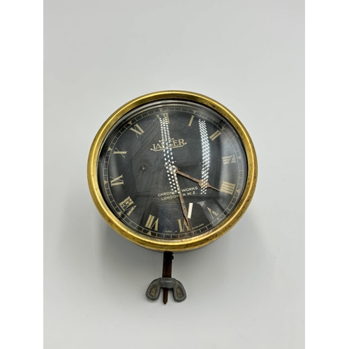 2280 - An early 20th century British Jaeger 8 Day car dashboard clock - approx. 8.5cm diameter