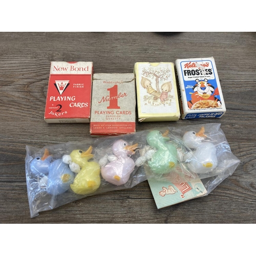 428 - A collection of items to include vintage boxed Merit Ring A Bell, porcelain headed doll, Sindy doll,... 