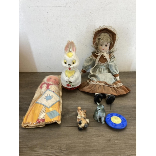 428 - A collection of items to include vintage boxed Merit Ring A Bell, porcelain headed doll, Sindy doll,... 