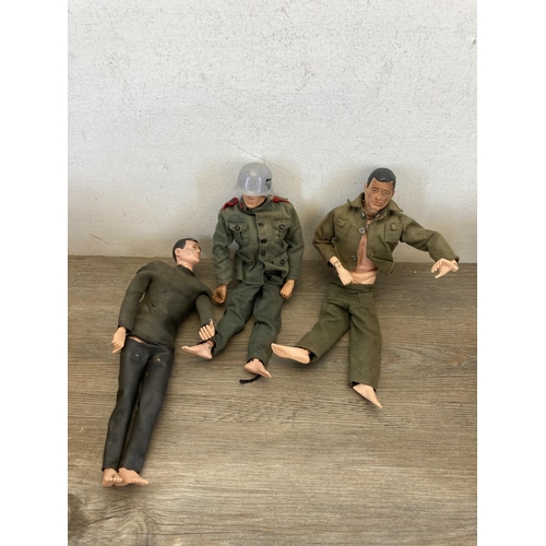 440 - Three 1960s Action Man figurines together with a large collection of Action Man clothing and accesso... 