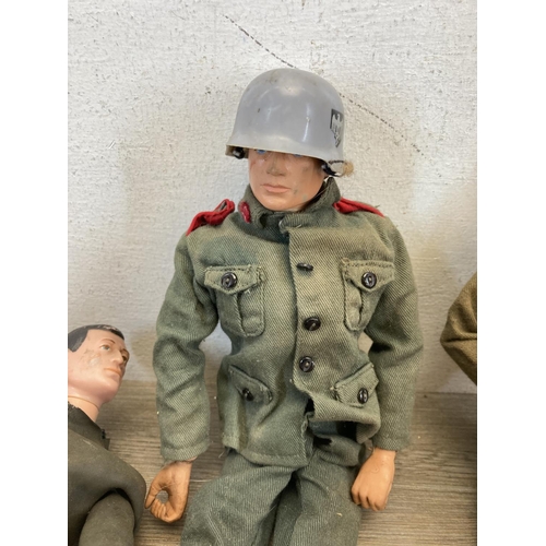 440 - Three 1960s Action Man figurines together with a large collection of Action Man clothing and accesso... 