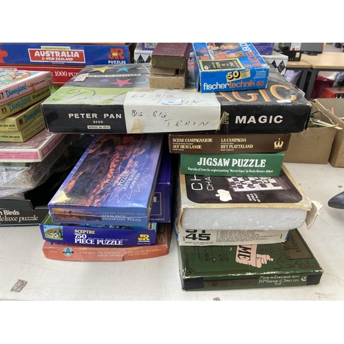 442 - A large collection of board games and jigsaw puzzles to include Disneyland, Chess etc.