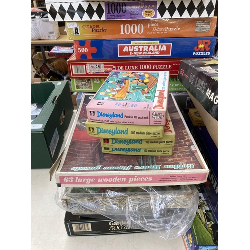 442 - A large collection of board games and jigsaw puzzles to include Disneyland, Chess etc.