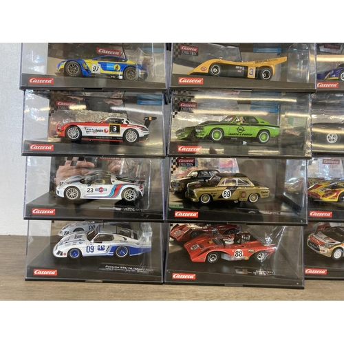 462 - Twenty three boxed Carrera Evolution & ExclusiV slot cars to include Aston Martin V12 Vantage GT3, M... 