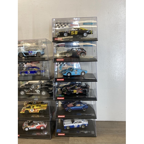 462 - Twenty three boxed Carrera Evolution & ExclusiV slot cars to include Aston Martin V12 Vantage GT3, M... 