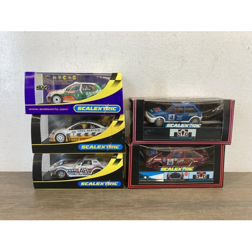 465 - Five boxed Scalextric slot cars, Skoda Fabia WRC Colin McRae - no.C2645, Ford Fiesta XR2i - no.C.470... 