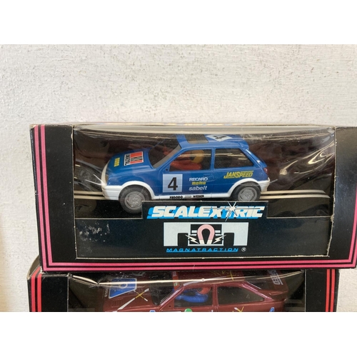 465 - Five boxed Scalextric slot cars, Skoda Fabia WRC Colin McRae - no.C2645, Ford Fiesta XR2i - no.C.470... 