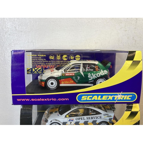 465 - Five boxed Scalextric slot cars, Skoda Fabia WRC Colin McRae - no.C2645, Ford Fiesta XR2i - no.C.470... 