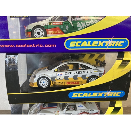 465 - Five boxed Scalextric slot cars, Skoda Fabia WRC Colin McRae - no.C2645, Ford Fiesta XR2i - no.C.470... 