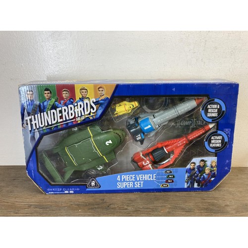 459 - A collection of Thunderbirds toys and collectables to include International Rescue game, Four Piece ... 