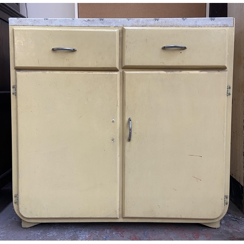 84 - A 1950s yellow painted kitchen cabinet with contents - approx. 90cm high x 91cm wide x 45cm deep