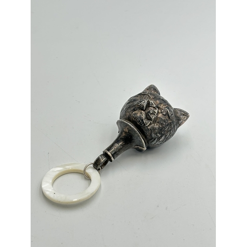 2340 - An antique hallmarked silver novelty cat shaped baby rattle with mother of pearl teething ring - app... 