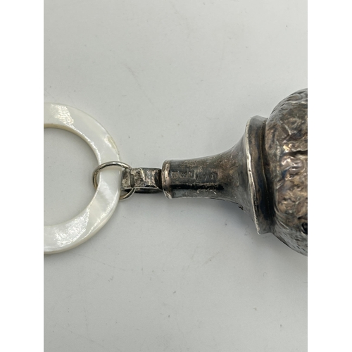 2340 - An antique hallmarked silver novelty cat shaped baby rattle with mother of pearl teething ring - app... 