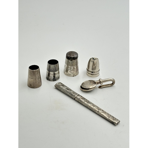 2348 - Six pieces of white metal and hallmarked silver to include hallmarked Birmingham silver napkin holde... 