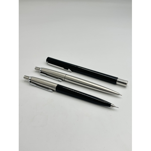 2396 - Three Parker writing instruments, two propelling pencils and one ballpoint pen