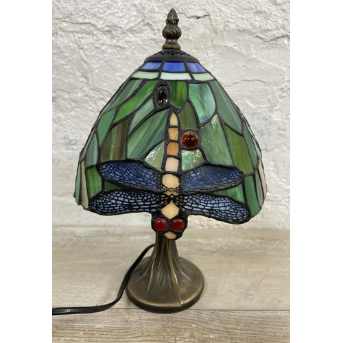 10 - A Tiffany style stained glass and bronze effect Dragonfly table lamp - approx. 30cm high