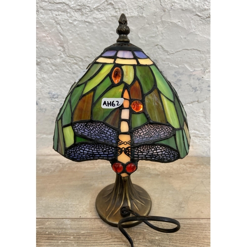 10 - A Tiffany style stained glass and bronze effect Dragonfly table lamp - approx. 30cm high