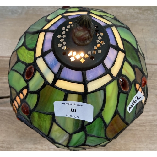 10 - A Tiffany style stained glass and bronze effect Dragonfly table lamp - approx. 30cm high