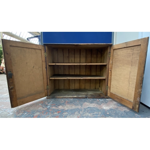 100A - A Victorian stained pine two door cabinet - approx. 80cm high x 94cm wide x 38cm deep