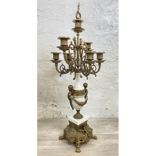 2 - A 20th century Italian Brevettato brass and white marble mantel clock and garniture set with cherub ... 