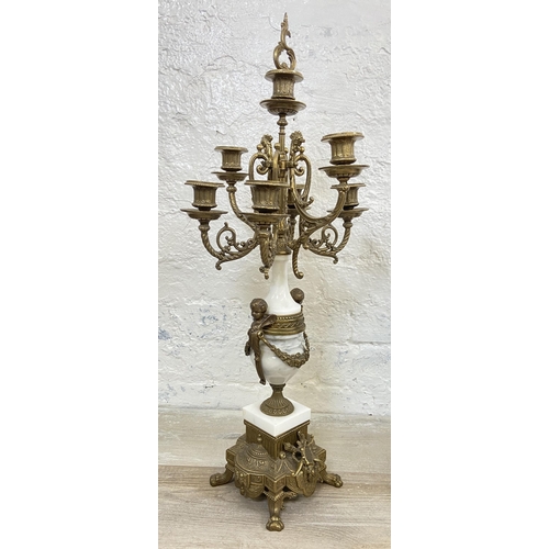 2 - A 20th century Italian Brevettato brass and white marble mantel clock and garniture set with cherub ... 