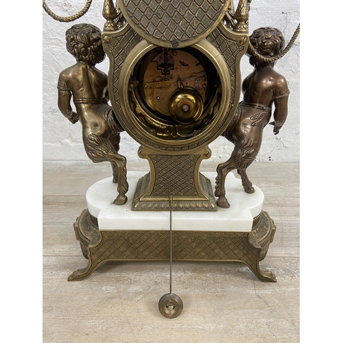 2 - A 20th century Italian Brevettato brass and white marble mantel clock and garniture set with cherub ... 