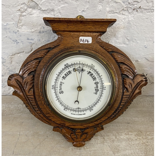 20 - Two items, one late 19th/early 20th century carved oak cased wall hanging barometer - approx. 27cm h... 