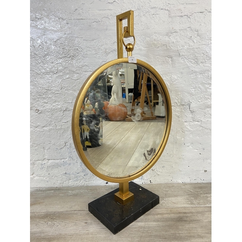 22 - A modern gilt framed bevelled edge circular hanging mirror on stand - approx. 77cm high x 46cm diame... 