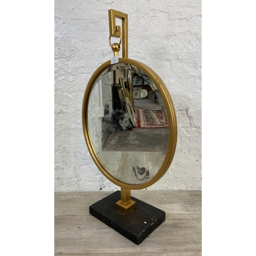 22 - A modern gilt framed bevelled edge circular hanging mirror on stand - approx. 77cm high x 46cm diame... 