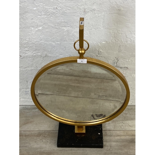 22 - A modern gilt framed bevelled edge circular hanging mirror on stand - approx. 77cm high x 46cm diame... 