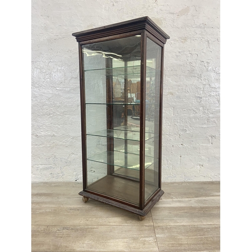 24 - A late 19th/early 20th century mahogany shop display cabinet with four glass shelves - approx. 114cm... 