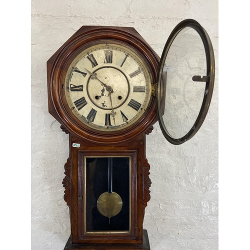 30 - A 19th century mahogany cased chiming wall clock with pendulum and key - approx. 100cm high x 41cm w... 