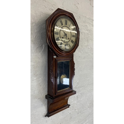 30 - A 19th century mahogany cased chiming wall clock with pendulum and key - approx. 100cm high x 41cm w... 