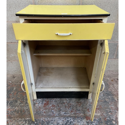 31 - Seven mid 20th century items, one yellow painted kitchen cabinet, two electric irons, one beech fold... 