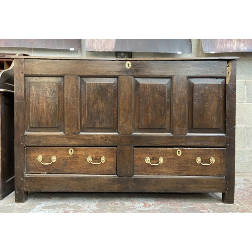 35 - A Georgian oak four panel mule chest - approx. 100cm high x 152cm wide x 67cm deep