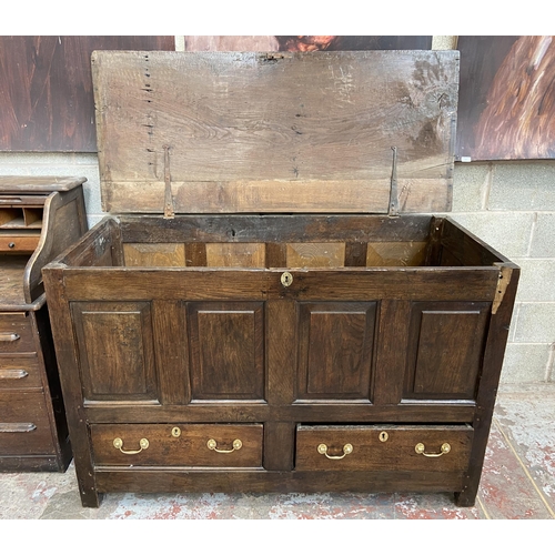 35 - A Georgian oak four panel mule chest - approx. 100cm high x 152cm wide x 67cm deep