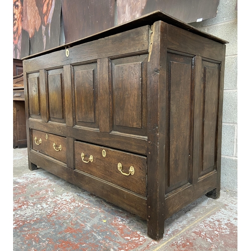 35 - A Georgian oak four panel mule chest - approx. 100cm high x 152cm wide x 67cm deep