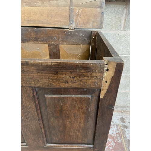 35 - A Georgian oak four panel mule chest - approx. 100cm high x 152cm wide x 67cm deep